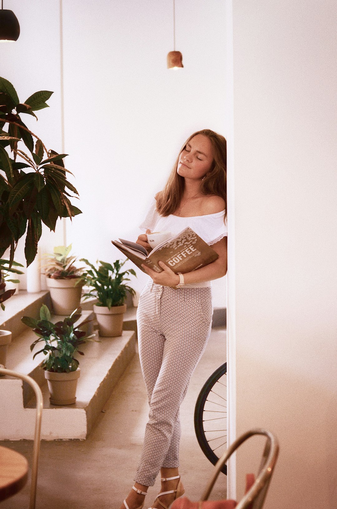 Woman enjoying a quiet morning moment as part of a daily wellness routine